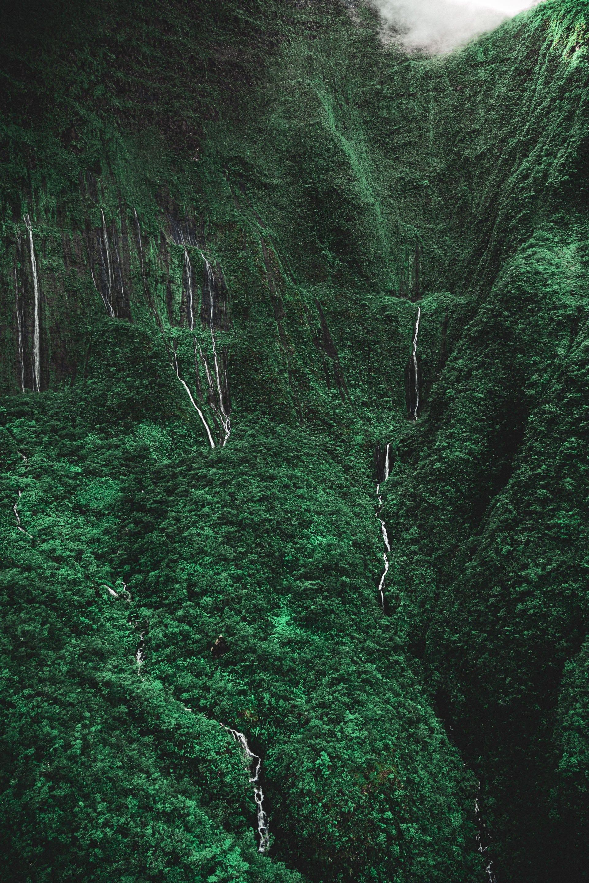 Dramatic-waterfall-maui-cascading-tears-valley-of-tears-unveiled-aerial-artwork-best-moments-best-sellers-best-wall-artwork-black-green-hawaii-helicopter-island-maui-maui-hawaii