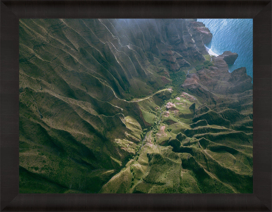 Over the Edge | Aerial Odyssey over Na Pali - Living Moments Media - 3500-5500, 800-3500, Abstract, Acrylic, aerial, Artwork, beach, Best Moments, Best Sellers, black, blue, Canvas, Coast, Cove, green, Hawaii, Helicopter, Honopu Beach, horizontal, Island, Kauai, Maui, Metal, Moody, Mountains, Na Pali Coast, new arrivals, New Moments, ocean, open-edition, over-5500, Prints, rocks, sand, size-18-x-24, size-30-x-40, size-42-x-56, Surf, trail, Trees, Visual Artwork, waves